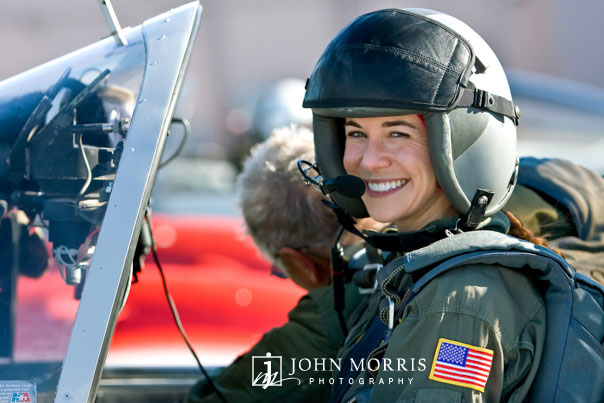 A female pilot smiles in anticipation of her first training flight.