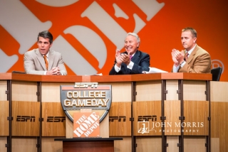 The crew of College Gameday, Lee Corso, Rece Davis, and Kirk Herbstreit reenact their popular presentation during a corporate event.
