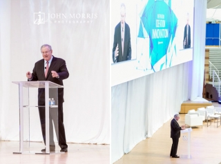 Steve Forbes on stage at the Aspen Institute speaking during a business conference.