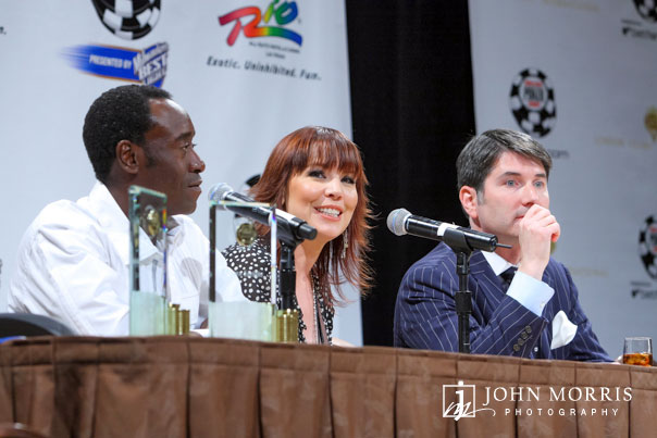 Panel of three celebrities, including Don Cheadle, speaking to a crowd of media during the World Series of Poker in Las Vegas