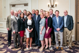 Speaker of the House, John Boehner poses with a group of executives during a conference in San Diego.
