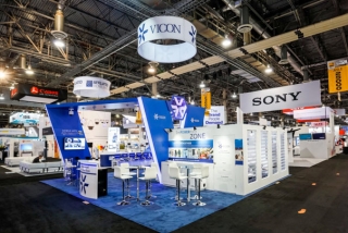 Exhibit booth for a large retail company in a large exhibit hall during a trade show in Las Vegas.