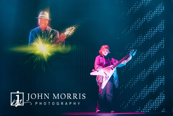 Hologram of BB King vanishing in a burst of light during an on stage performance with a live guitar prodigy during a keynote session