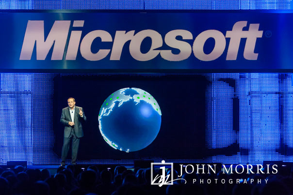 CEO presentation during a keynote speech at a corporate event with a hologram of the world created on stage