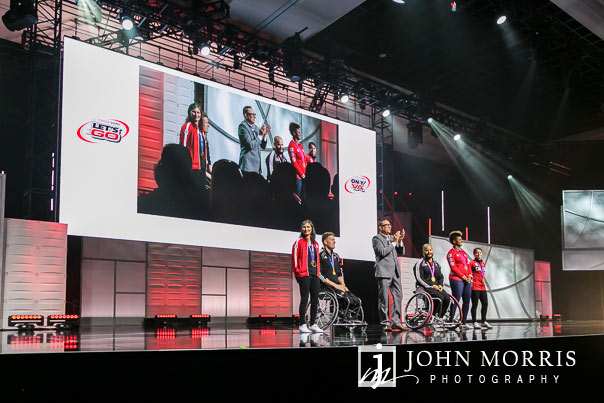 Mid range stage image of Olympians during a motivation segment of a general session during a corporate event at the Mandalay Bay Convention Center in Las Vegas