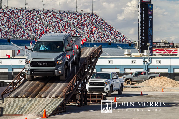 Trucks carrying event attendees through an exciting obstacle course in the infield of the Las Vegas Motor Speedway in Las Vegas as photographed by a San Diego Event Photographer