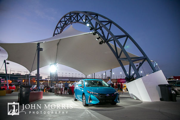 Balanced evening light with accent and spotlights of an automobile display during a corporate event and outing the Las Vegas Motor Speedway in Las Vegas as photographed by a San Diego Event Photographer