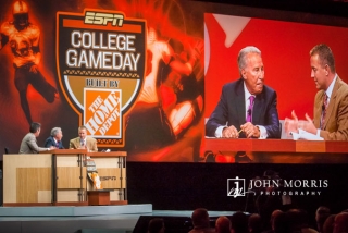 The crew of College Gameday, Lee Corso, Rece Davis, and Kirk Herbstreit reenact their popular presentation during a corporate event.