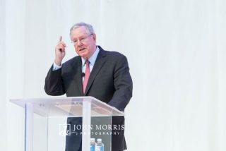 Steve Forbes making a point while speaking from a podium on stage during conference at the Aspen Institute in Aspen CO.