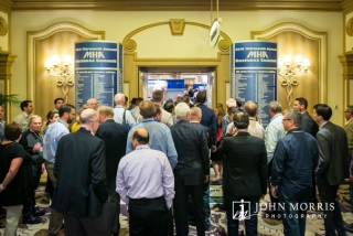 Large crowd packing into a trade show during a conference at the Belagio in Las Vegas