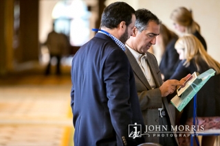 Two professionals sharing ideas during a conference networking event