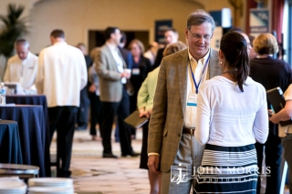Two attendees sharing ideas during a Corporate Event networking session