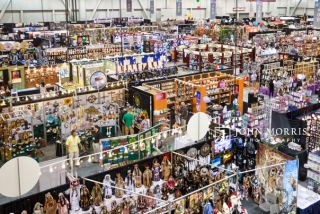An aerial view of a full show room floor full of booths during a trade show.