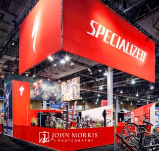 Bright red exhibit booth for a cycling trade show.